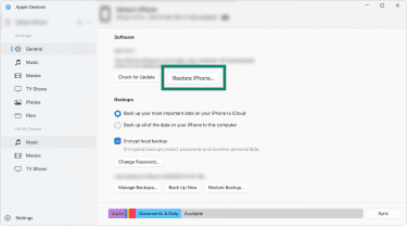 Windows' Apple Devices app interface, showing a connected iPhone and the Restore iPhone button in focus.